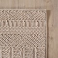 dywan-nowoczesny-3d-helix-boho-bezowy-zblizenie-rogu-dywanu-z-widocznym-obszyciem-obu-bokow.jpg