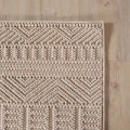 dywan-nowoczesny-3d-helix-boho-bezowy-zblizenie-rogu-dywanu-z-widocznym-obszyciem-obu-bokow.jpg
