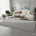 dywan-nowoczesny-3d-helix-szary-rzut-aranzacja-w-salonie-z-jasna-sofa-i-oknem-w-tle.jpg