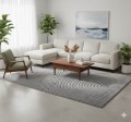 dywan-nowoczesny-art-3d-geometria-szary-aranzacja-na-jasnej-podlodze-z-jasna-sofa-i-oknem-w-tle-stolikiem-kawowym na -srodku-dywanu-i-fotelem.jpg