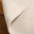 Dywan-Zaran-kośc słoniowa-100%-bawełna-pure-cotton-ręcznie-tkany-zbliżenie-obszycie-dywanu.jpg