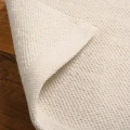 Dywan-Zaran-kośc słoniowa-100%-bawełna-pure-cotton-ręcznie-tkany-zbliżenie-obszycie-dywanu.jpg
