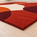 Dywan_wełniany_Dune_Teracotta_Prostokąt_detal_narożnika_i_obszycia.jpg